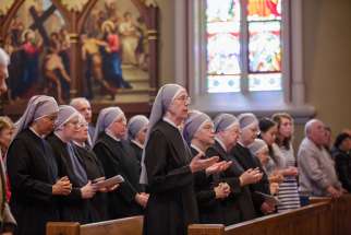 Members of the Little Sisters of the Poor pray during Mass at the Basilica of the Sacred Heart at the University of Notre Dame in Indiana April 9.