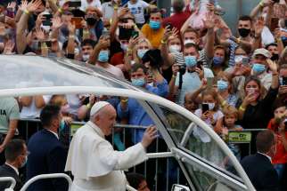 Pope Francis greets the crowd as he arrives for a meeting with young people at Lokomotiva Stadium in Košice, Slovakia, Sept. 14, 2021.