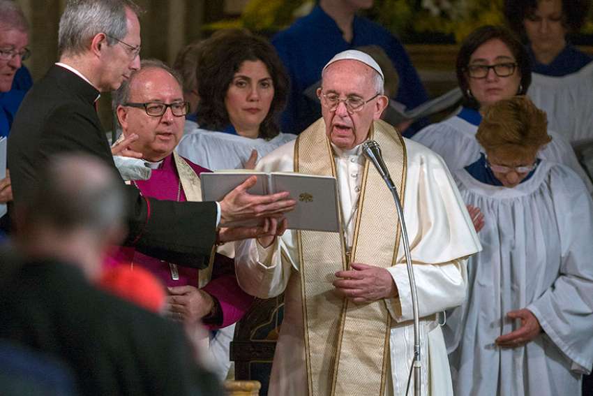 Pope Francis delivers his blessing during an evening prayer service at All Saints&#039; Anglican Church in Rome Feb. 26. It was the first time a pope has visited an Anglican place of worship in Rome.