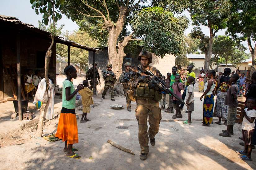 A French peacekeeping soldier patrols the streets of Bangui, Central African Republic, in 2013. The Vatican is monitoring the situation in Central Africa, but Pope Francis still plans to visit.