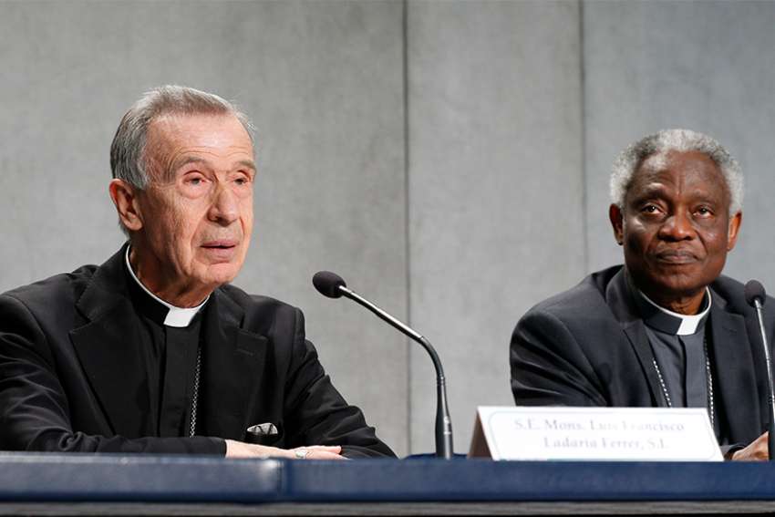  Archbishop Luis Ladaria, prefect of the Congregation for the Doctrine of the Faith, and Cardinal Peter Turkson, prefect of the Dicastery for Promoting Integral Human Development, lead a May 17 Vatican news conference for the release of a document on the moral dimensions of economic activity. The new document, approved by Pope Francis, says financial and economic decisions can be virtuous or sinful. 
