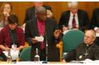 On Jan. 26, Anglican archbishop of York John Sentamu laid hands on the Rev. Libby Lane in an ordination ceremony. In this photo, Sentamu speaks as Archbishop Justin Welby of Canterbury, the leader of the worldwide Anglican Communion looks on during the Church of England&#039;s General Synod at Church House in central London Nov. 20. The Church of England&#039;s law-making body voted in favour of female bishops that day, a move that ended a 20-year impasse and could see women ordained as senior clergy.