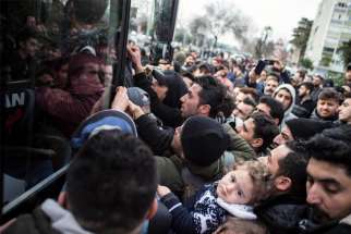 Syrian refugees try to reach the Turkish-Greek border in Turkey Feb. 28, 2020. Turkey and Greece are trading blame following the deaths of Syrian refugees trying to flee to Europe.
