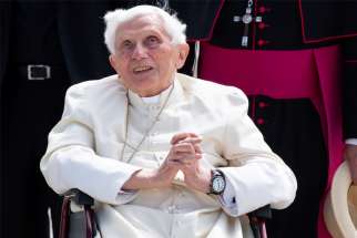 Retired Pope Benedict XVI smiles at Germany&#039;s Munich Airport before his departure to Rome June 22, 2020. Pope Benedict, who is 93, traveled to Germany to see his ailing older brother, Msgr. Georg Ratzinger, who is 96.