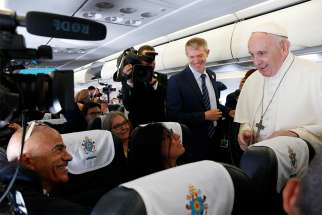 Pope Francis meeting journalists aboard his flight from Rome to Dublin Aug. 25