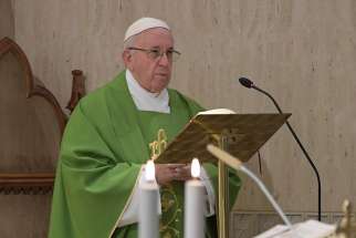 Pope Francis gives the homily as he celebrates morning Mass in the chapel of his residence, the Domus Sanctae Marthae, at the Vatican Sept. 11. The Pope said the devil seeks to reveal sins in order to scandalize the people of God. 