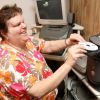 Carmen Greico, the folk choir director at St. Bernard Church in Levittown, N.Y., prepares to listen to a CD of daily reflections at her home in Levittown June 29. The CD is produced and distributed by the Xavier Society for the Blind