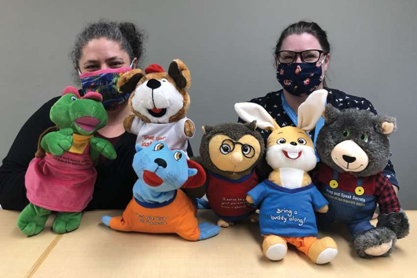 Natasha Tsevende, left, and Sue Devlin of the Kenora Catholic school board’s mental health team with puppets used in Kids in the Know to help students learn safety strategies to prevent abuse.