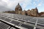  Solar panels are seen on the roof of the Paul VI audience hall at the Vatican in this Dec. 1, 2010, file photo. In a videomessage, Pope Francis told the Virtual Climate Ambition Summit that Vatican City is aiming for net zero carbon emissions.