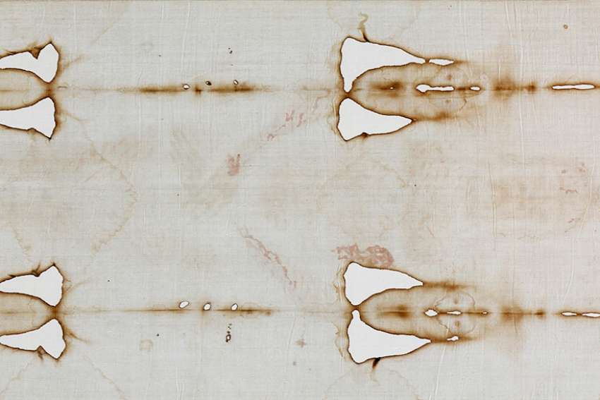 A detail view of the Shroud of Turin is seen in 2015 during a preview for journalists at the Cathedral of St. John the Baptist in Turin, Italy. A leading expert on the cloth, believed to be the burial shroud of Jesus, dismissed a new study claiming that blood patterns on the shroud are not consistent with those left by a crucified person. 