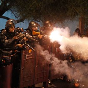 Riot police fire rubber bullets at demonstrators during clashes near Rio de Janeiro&#039;s Guanabara Palace, where Pope Francis met with Brazilians politicians July 22. Demonstrators are continuing their anti-government protests, which began in June amid grow ing economic and social dissatisfaction in Brazil.