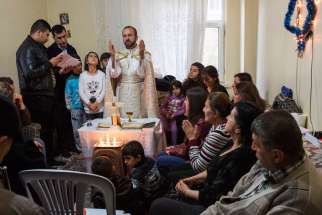 Chaldean Father Remzi Diril, also known as Father Adday, celebrates Mass at an apartment in Kirsehir, Turkey, Nov. 10.