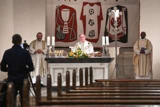 A priest celebrates Holy Thursday Mass via livestream April 9, 2020, at a nearly empty church in Bonn, Germany. The head of the German bishops&#039; conference voiced disappointment that the government decided April 15 the ban on public church services should remain until further notice because of the COVID-19 pandemic.
