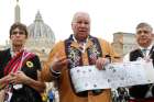 David Chartrand, president of the Manitoba Métis Federation, holds a timeline as he speaks with journalists following a meeting of a Canadian Métis delegation with Pope Francis at the Vatican April 21, 2022.