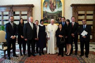 Pope Francis meets with a delegation from the International Commission Against the Death Penalty in the papal library of the apostolic palace Dec. 17. 