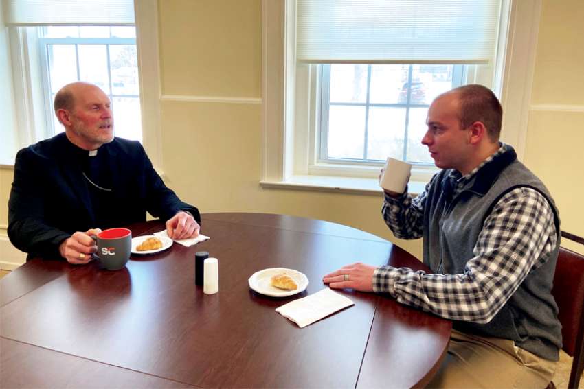 Bishop Thomas R. Zinkula of Davenport, Iowa, and Patrick Schmadeke, diocesan director of evangelization, have a conversation Jan. 28, 2022, about the &quot;58,000 Cups of Coffee Initiative.&quot; It is &quot;a deep and thorough listening&quot; process involving diocesan Catholics as part of local preparations for the church&#039;s 2023 world Synod of Bishops on synodality.