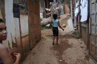  Girls play in the Tribo neighbourhood near Sao Paulo, Brazil, May 16. The World Day of the Poor – to be marked each year on the 33rd Sunday of ordinary time – will be celebrated Nov. 18.