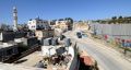 The Israeli separation wall, right, is seen at the edge of the Aida refugee camp, left, in Bethlehem, West Bank.