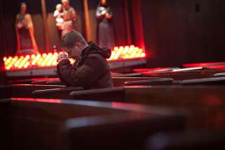 A man prays during Ash Wednesday Mass at St. Andrew&#039;s Church in the Manhattan borough of New York March 5, 2014.