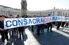 A sign in St. Peter&#039;s Square calls for the consecration of Russia and Ukraine to Mary, before the start of Pope Francis&#039; Angelus at the Vatican March 13, 2022. The Vatican said Pope Francis will consecrate Russia and Ukraine to the Immaculate Heart of Mary March 25.