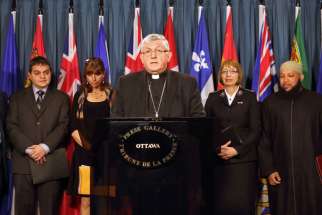 Cardinal Thomas Collins of Toronto speaks alongside other Canadian religious leaders during an April 19 news conference on Parliament Hill in Ottawa, Ontario. The group, representing Jewish, Muslim and Christian communities, held a joint news conference to express their &quot;grave concern&quot; over the decriminalization of assisted suicide and euthanasia.