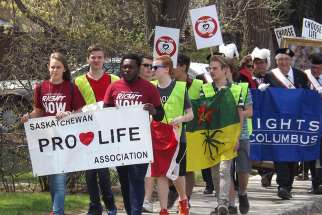 Regina pro-lifers marched from Christ the King Parish, where they had celebrated a noon-hour prayer and worship service, through the streets of the neighbourhood and down Albert Street to the legislature.