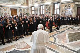 Pope Francis arrives for a meeting with the rectors of public and private universities from Latin America and the Caribbean at the Vatican Sept. 21, 2023. Responding to questions, the pope said his new document on the environment would be called &quot;Laudate Deum&quot; (Praise God).