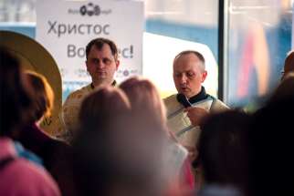 Canadian Armed Forces Chaplain Captain Antin Sloboda holds Orthodox Easter Mass service at a reception centre in Warsaw, Poland, for Ukrainian refugees, in support of Task Force Poland on April 23.