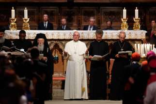 Ecumenical Patriarch Bartholomew of Constantinople, Pope Francis, an unidentified clergyman and Anglican Archbishop Justin Welby of Canterbury, England, attend an ecumenical prayer service with other Christian leaders in the Basilica of St. Francis in Assisi, Italy, Sept. 20.