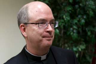 U.S. Msgr. Robert Oliver, secretary of the Pontifical Commission for the Protection of Minors, has been named by Pope Francis as the contact person for people with information or concerns about potential cases of abuse and cover-up within the Vicariate of Vatican City State. Msgr. Oliver is pictured in a Feb. 5, 2013, photo.