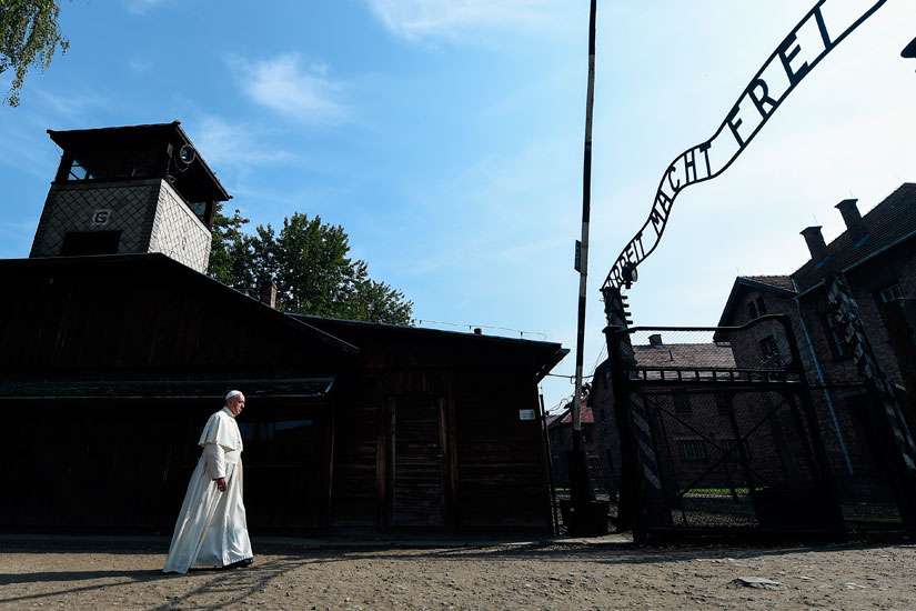 Pope Francis enters the main gate of the Auschwitz Nazi death camp in Oswiecim, Poland, July 29.