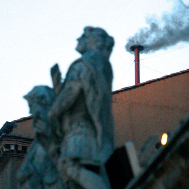 Black smoke rises from the chimney of the Sistine Chapel April 18, 2005 signaling that the cardinals had taken their first vote for a new pope, but the vote was not conclusive.