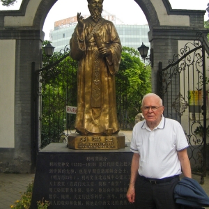 Douglas Roche stands in front of a bronze statue of the Italian Jesuit Matteo Ricci in Beijing, China. Beijing was one of four stops on a world tour where Roche was able to draw strength through the celebration of Mass.