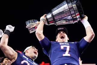 Quarterback Cody Fajardo, above hoisting the Grey Cup at the Montreal Alouettes’ victory parade in downtown Montreal.