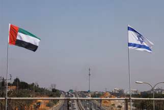 The national flags of Israel and the United Arab Emirates flutter along a highway in Netanya, Israel, Aug. 17, 2020.