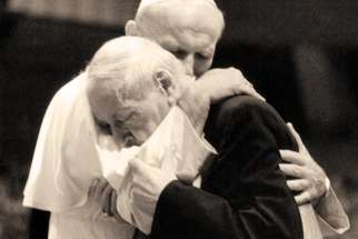Pope John Paul II and Polish Cardinal Stefan Wyszynski embrace at the pope’s inaugural Mass in 1978.