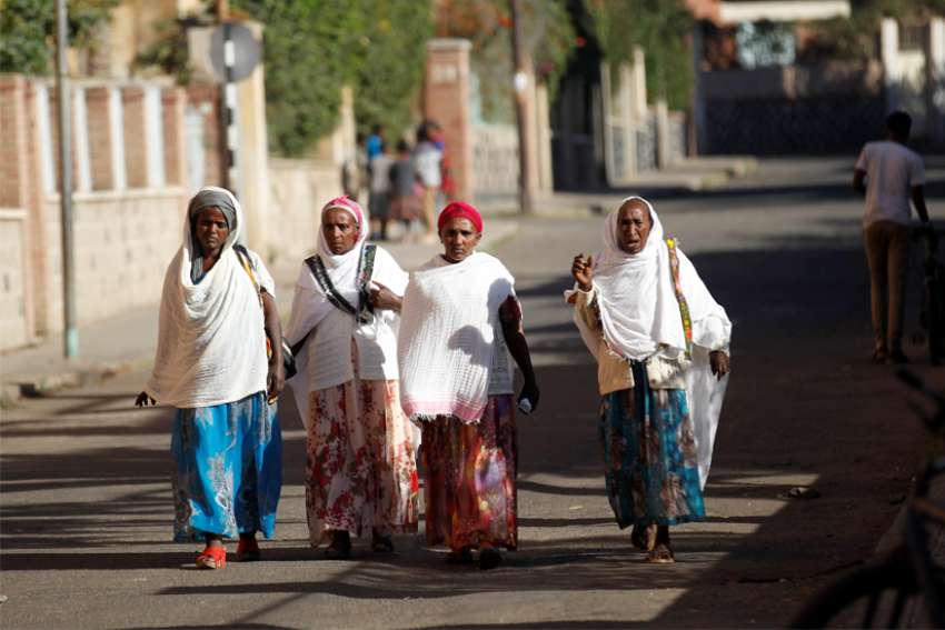 Women walk along a street Feb. 20, 2016, in Asmara, Eritrea.