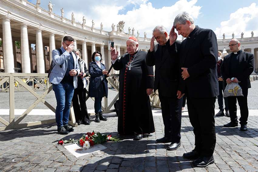 Cardinal Stanislaw Dziwisz, the former secretary of St. John Paul II, prays at the spot of the May 13, 1981, assassination attempt against the Polish pope, after placing flowers in St. Peter&#039;s Square at the Vatican May 13, 2021. Cardinal Dziwisz and a small group of Catholics gathered in the square to mark the 40th anniversary of the shooting. In 1981 then-Msgr. Dziwisz cradled the Pope after the shooting. 