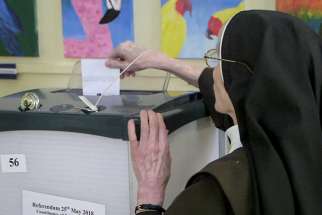 A woman religious casts her ballot May 25 in Dublin as Ireland holds a referendum on its law on abortion. Voters went to the polls May 25 to decide whether to liberalize the country&#039;s abortion laws.