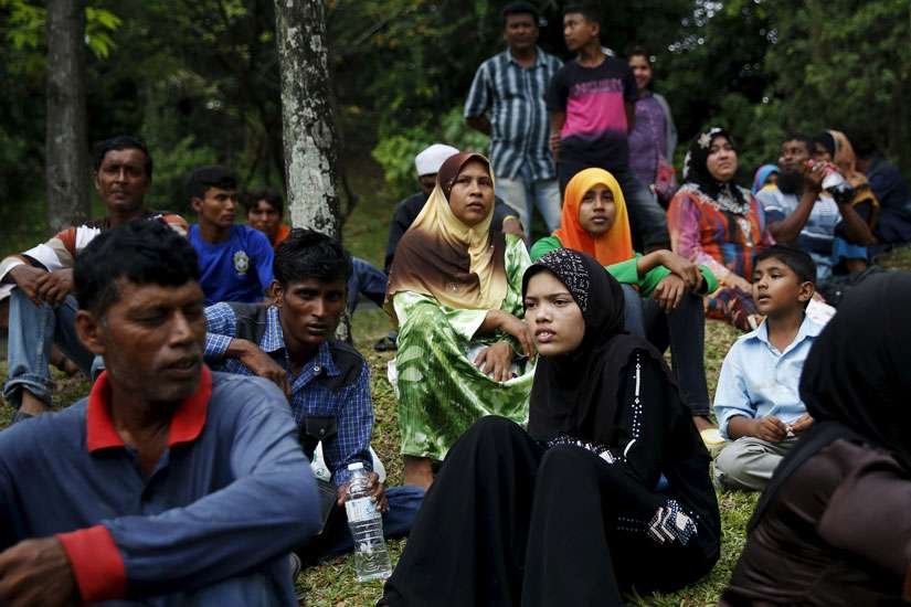 Refugees from Myanmar&#039;s ethnic minority communities wait for access to the U.N. Refugee Agency building in Kuala Lumpur, Malaysia, Aug.11. Exploitation and discrimination abound among refugees from Myanmar&#039;s ethnic minority communities who have landed in Malaysia, a five-member contingent from the U.S. Conference of Catholic Bishops learned.