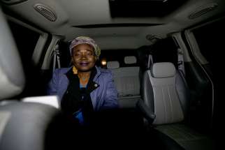 A Haitian woman, who gave her name as Cilotte, takes a taxi to the U.S.-Canada border April 26 from Champlain, N.Y. 