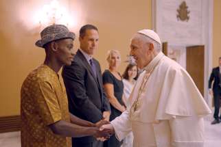 Pope Francis meets with Arouna Kande of Senegal, whose story is related in the film The Letter.