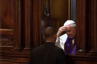 Pope Francis hears the confession of a priest March 7, 2019, at Rome&#039;s Basilica of St. John Lateran. The pope administered the sacrament to several priests during his annual Lenten meeting with the priests of the Diocese of Rome. 