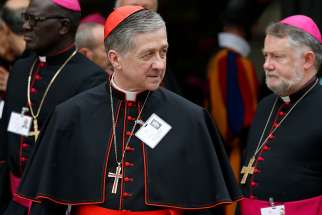 Cardinal Blase J. Cupich of Chicago leaves a session of the Synod of Bishops on young people, the faith and vocational discernment at the Vatican Oct. 11. 