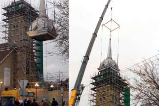 A couple of hundred parishioners and townsfolk turned out to watch as Windsor construction company W.D. Lester used a truck crane to hoist the almost 14,000 kg (30,000 lbs.) steeple into place in less than a half hour.