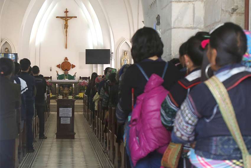 A priest celebrates Mass in 2015 at a church attended by ethnic Hmong Catholics in the village of Sapa, Vietnam. Delegations from the Vatican and from Vietnam reported continued progress in their discussions, including agreeing on &quot;upgrading&quot; relations with a permanent papal representative &quot;in the near future,&quot; a Vatican press statement said. 