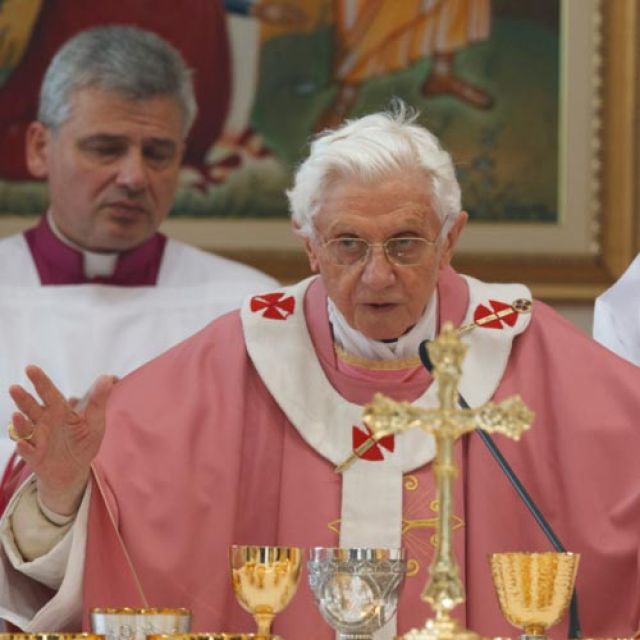 Pope Benedict XVI celebrates the Eucharist during Mass at St. Patrick Parish in the eastern suburbs of Rome Dec. 16. Upon returning to the Vatican for the noon Angelus, the pope offered his condolences and prayers to those affected by the Dec. 14 shootin g massacre at a Newtown, Conn., elementary school.