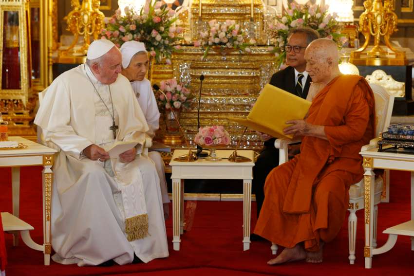 Pope Francis visits with Somdej Phra Maha Muneewong, supreme patriarch of Buddhists, at the Wat Ratchabophit temple in Bangkok Nov. 21, 2019.