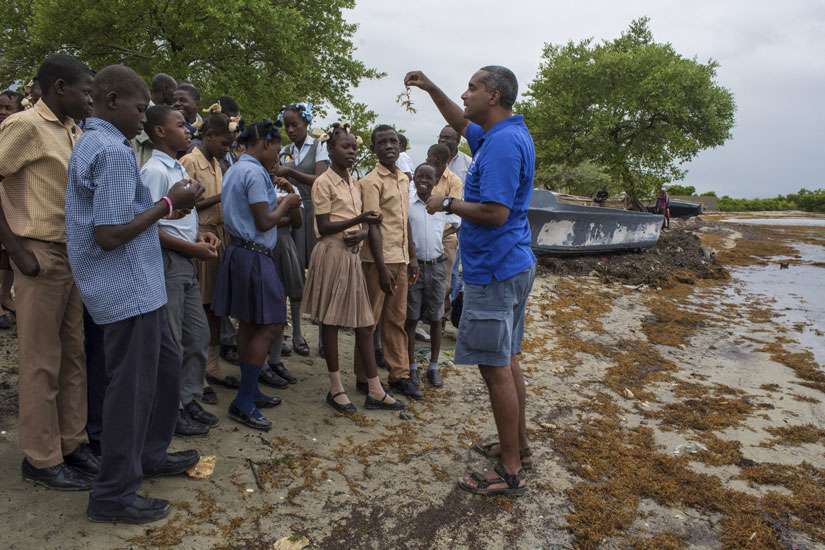 Marine biologist Jean Wiener meets with high school students in late January to discuss their threatened natural resources along the costal area of Caracol, Haiti. Few papal encyclicals have been as eagerly awaited as Pope Francis&#039; upcoming statement on the environment. 