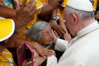 Pope Francis greets a blind woman who is 99 years old along the parade route in Trujillo, Peru, Jan. 20. At the end of their plenary meeting March 6-9 at the Vatican, members of the Pontifical Commission for Latin America proposed that the church hold a Synod of Bishops &quot;on the theme of the woman in the life and mission of the church.&quot;